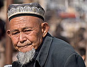 Uyghur man at the livestock market, Kashgar, China